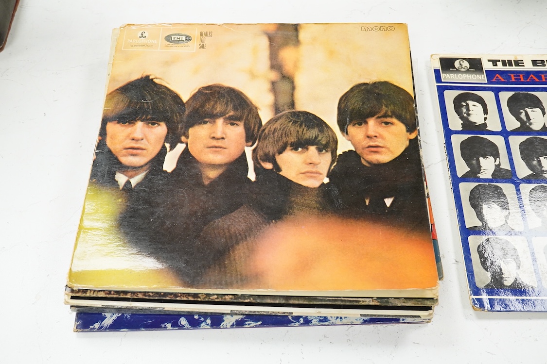 Eleven LP record albums including nine The Beatles and related albums; Beatles For Sale, Hey Jude, Yellow Submarine, All Things Must Pass, etc., together with the Rolling Stones; Their Satanic Majesties Request, and Pink